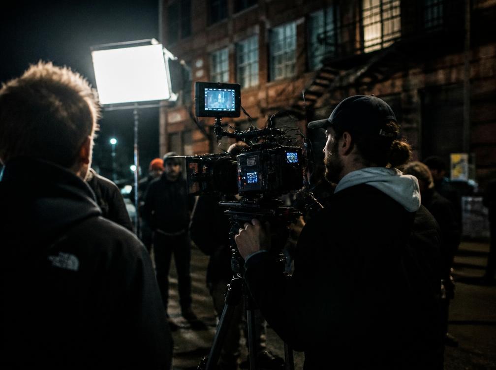 Cinematographer filming at night